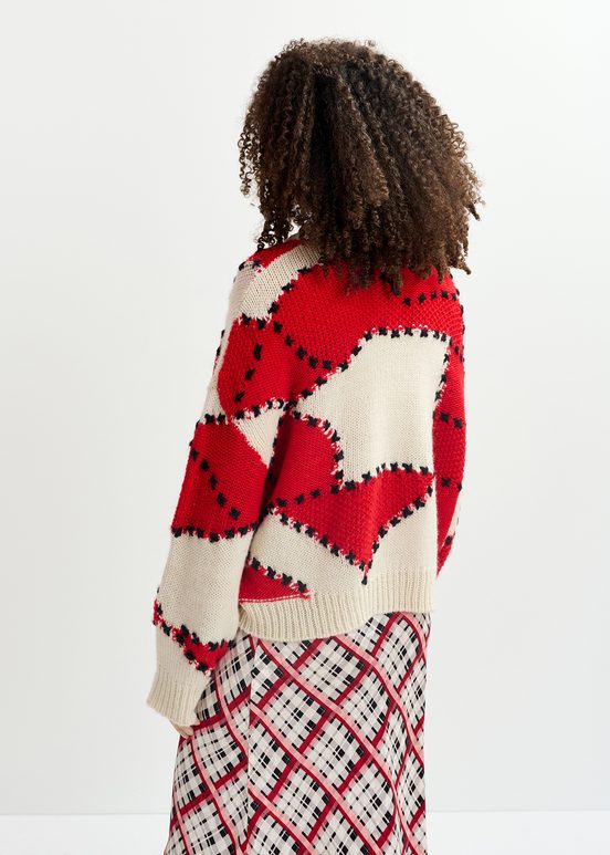 Ecru and red patchwork knit sweater