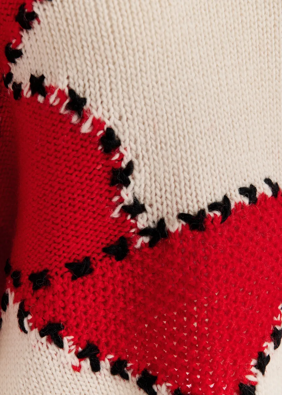 Ecru and red patchwork knit sweater