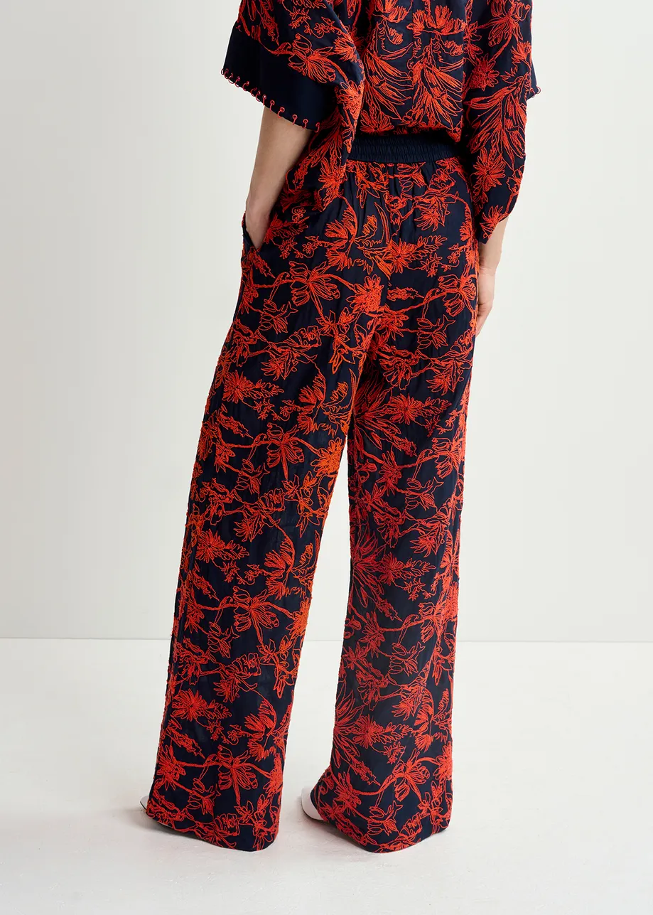 Navy blue wide-leg pants with floral embroideries