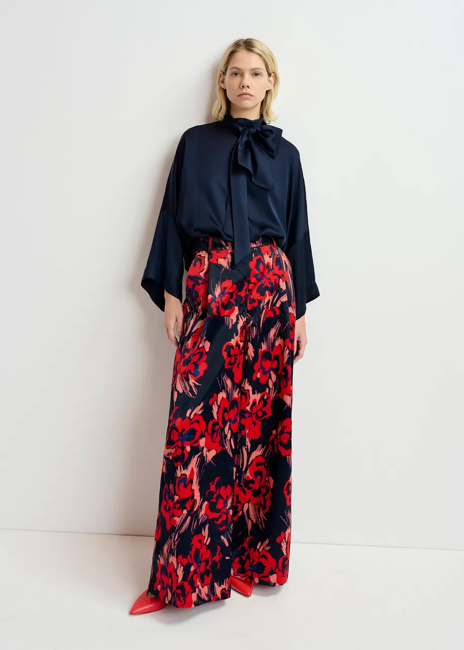 Navy blue satin wide-leg pants with floral print