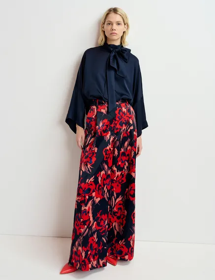 Navy blue satin wide-leg pants with floral print