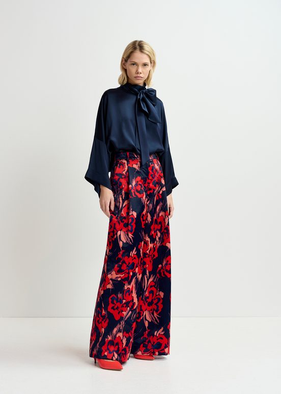 Navy blue satin wide-leg pants with floral print