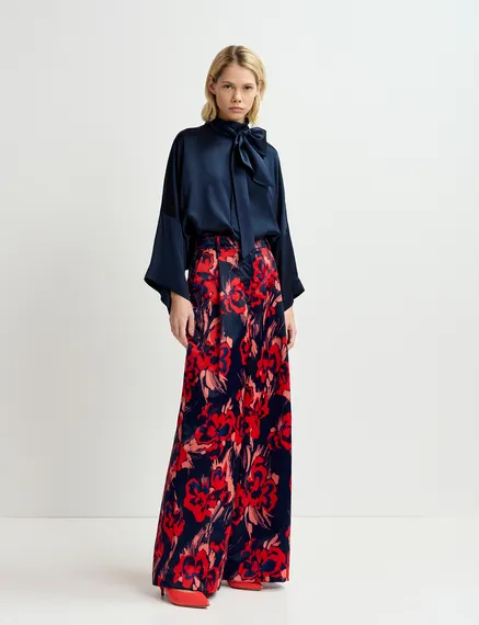 Navy blue satin wide-leg pants with floral print