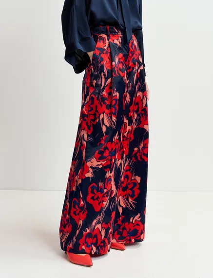 Navy blue satin wide-leg pants with floral print