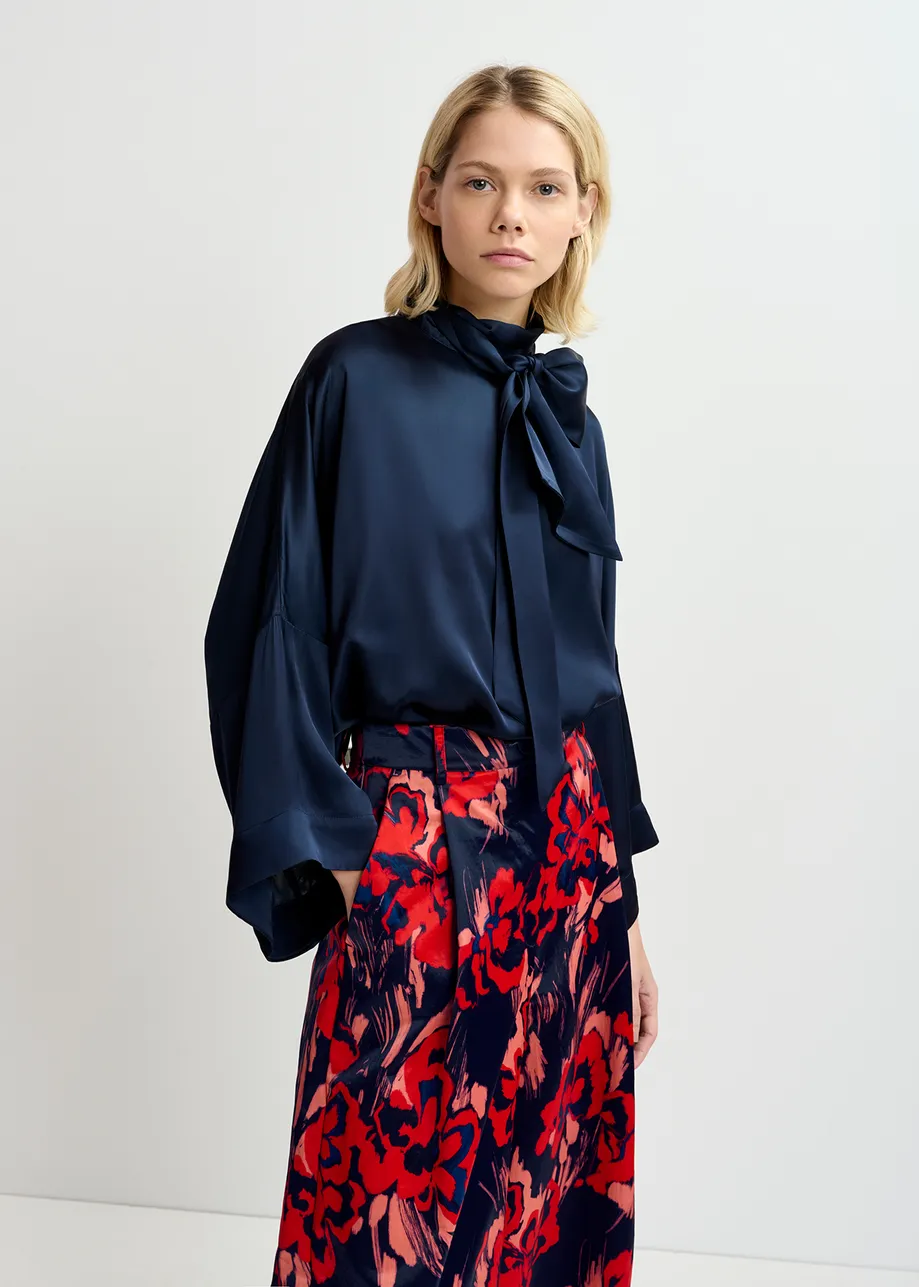 Navy blue satin wide-leg pants with floral print