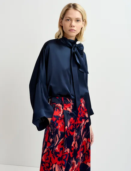 Navy blue satin wide-leg pants with floral print