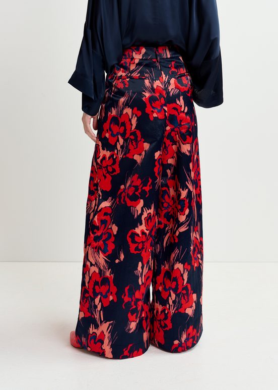 Navy blue satin wide-leg pants with floral print