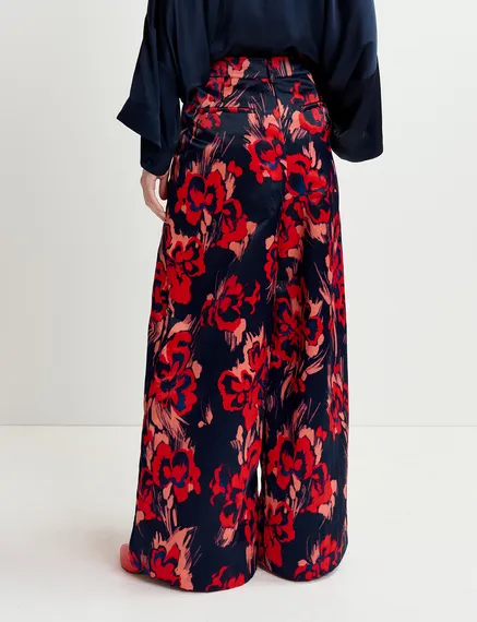 Navy blue satin wide-leg pants with floral print