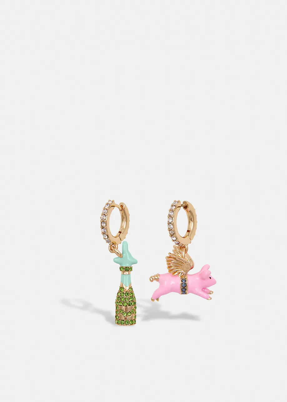 Gold-tone hoop earrings with champagne bottle and flying pig pendants