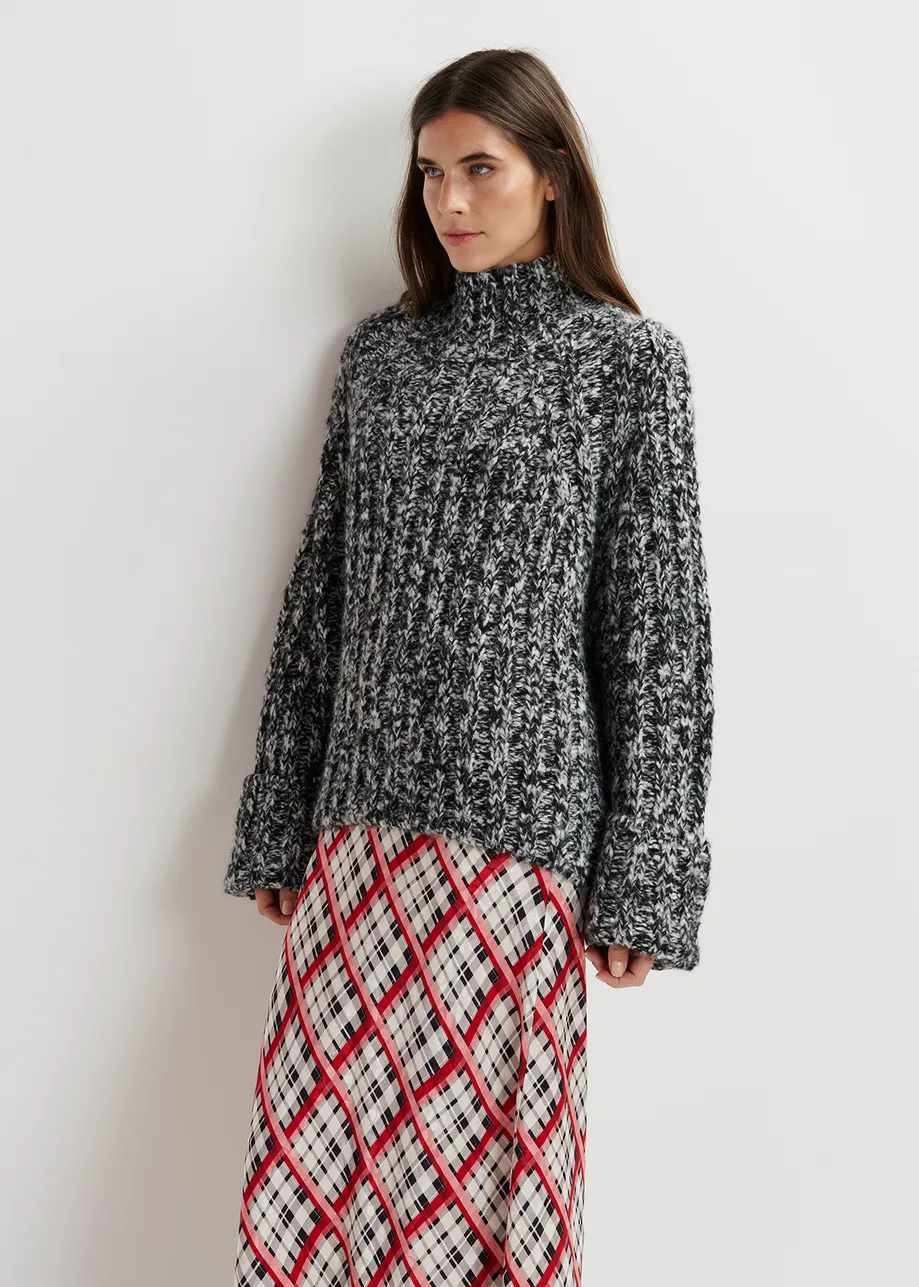 Black and ecru mélange knit sweater with turtleneck