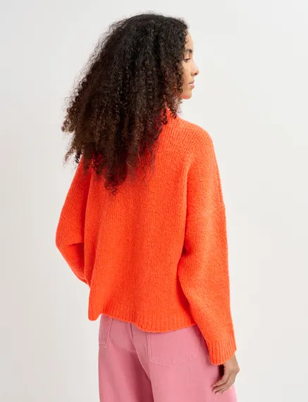 Pull en gros tricot orange fluo