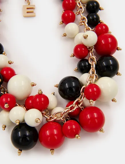 Collier en perles rouge, blanc cassé et noir