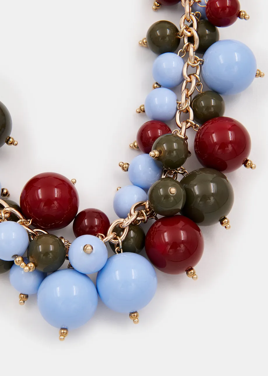 Collier en perles bleu, bordeaux et kaki