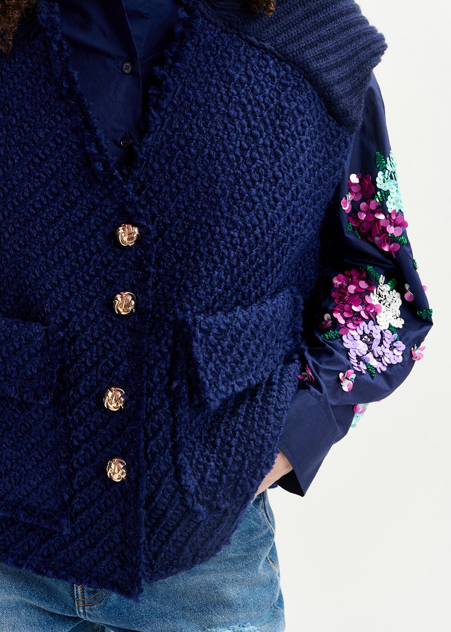 Navy blue sleeveless knitted jacket