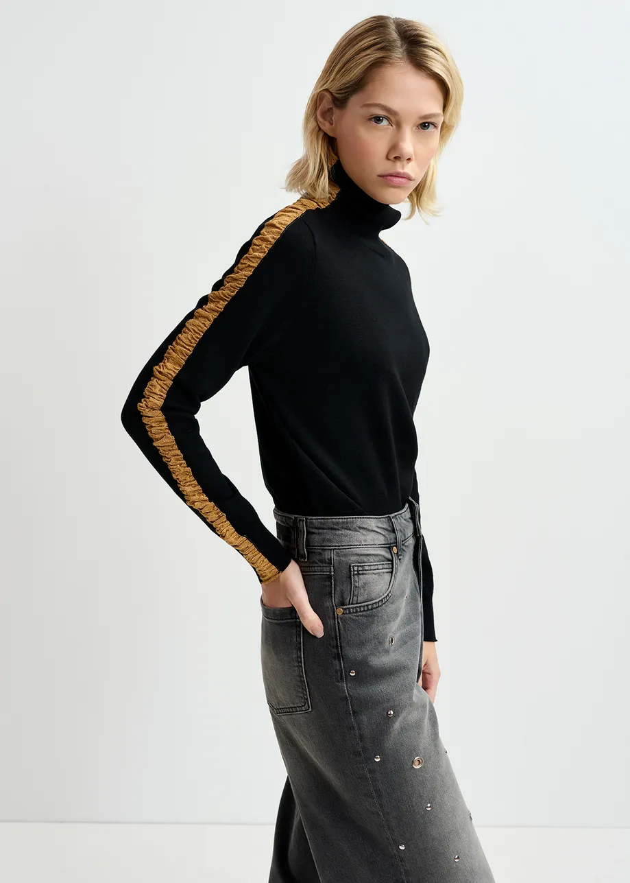 Black turtleneck knit sweater with golden stripes