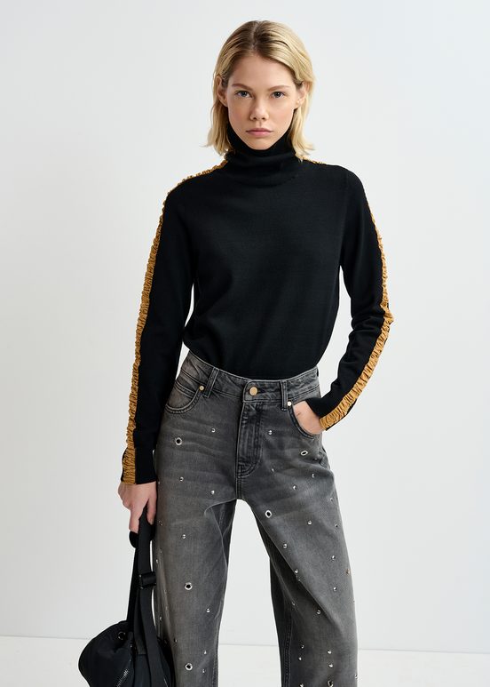 Black turtleneck knit sweater with golden stripes