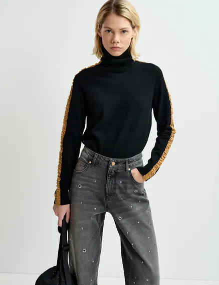 Black turtleneck knit sweater with golden stripes