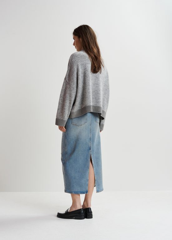 Jupe midi en denim bleu orné d'œillets