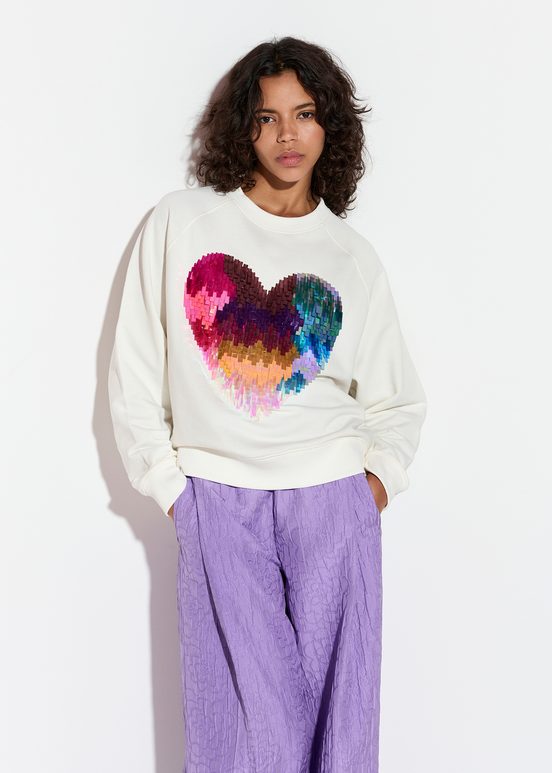 Gebroken witte biokatoenen sweater met hart van pailletten