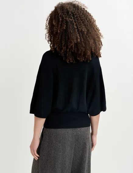 Black cape-effect knit sweater with embellishments