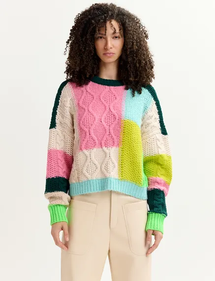 Ecru, lime green and pink cable-knitted patchwork sweater