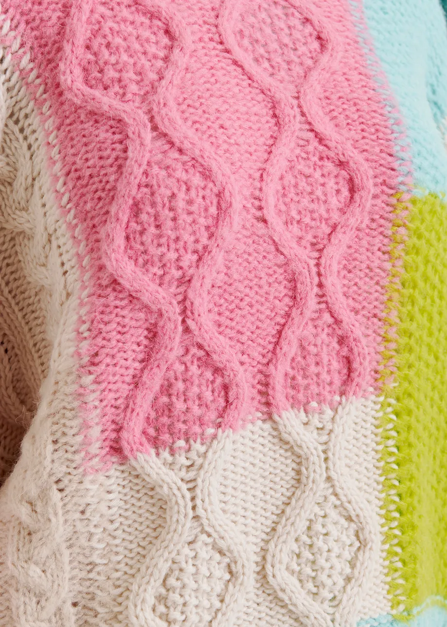 Ecru, lime green and pink cable-knitted patchwork sweater