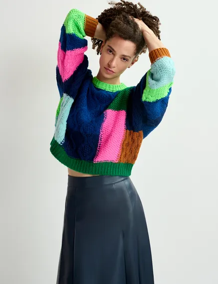 Navy blue, green and neon pink cable-knitted patchwork sweater