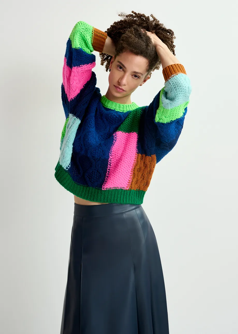 Navy blue, green and neon pink cable-knitted patchwork sweater