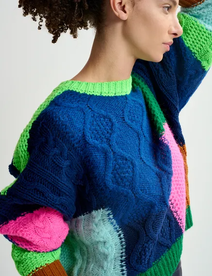 Navy blue, green and neon pink cable-knitted patchwork sweater