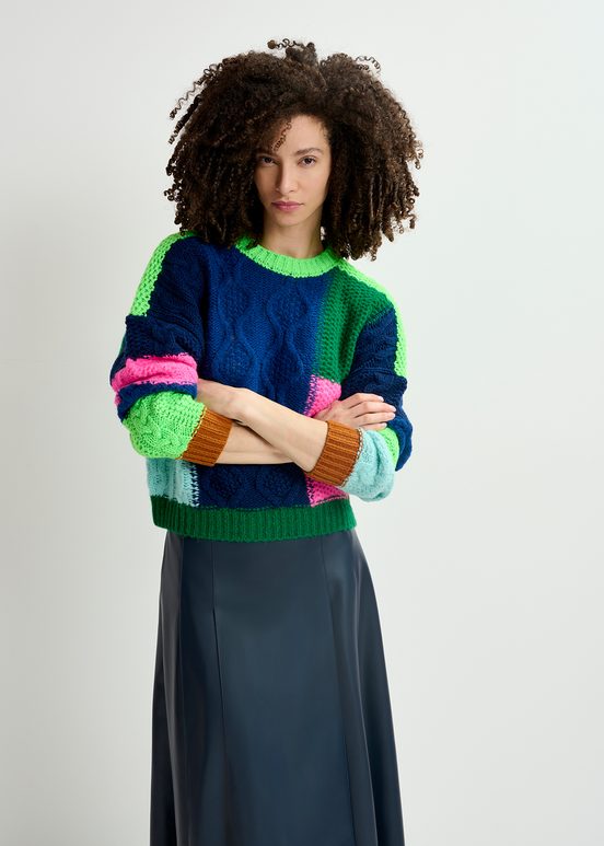 Navy blue, green and neon pink cable-knitted patchwork sweater