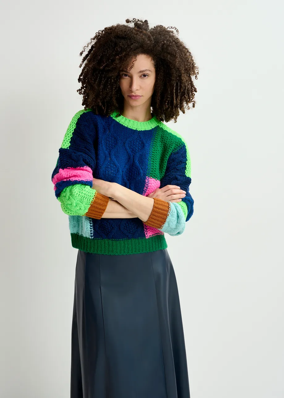 Navy blue, green and neon pink cable-knitted patchwork sweater