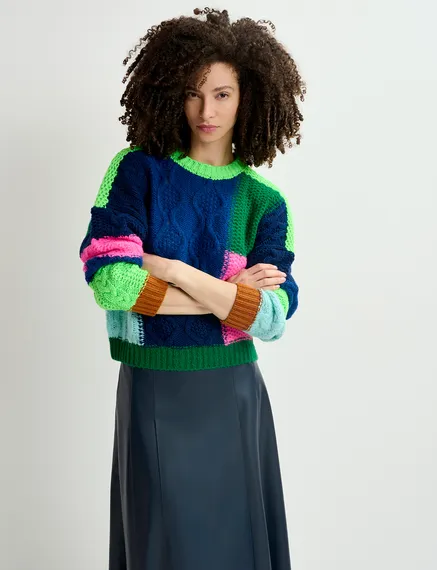 Navy blue, green and neon pink cable-knitted patchwork sweater