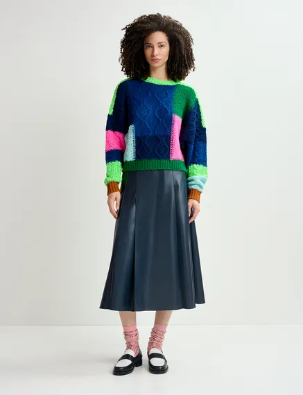 Navy blue, green and neon pink cable-knitted patchwork sweater