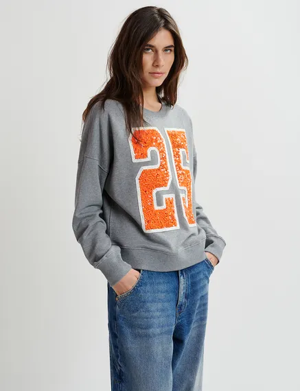 Grey and orange organic cotton sweatshirt with sequin and bead "25" embroideries