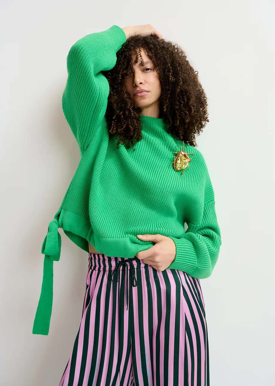 Green rib-knitted sweater with bows