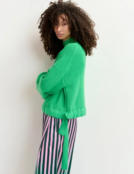 Green rib-knitted sweater with bows