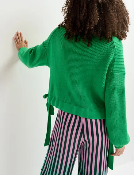 Green rib-knitted sweater with bows