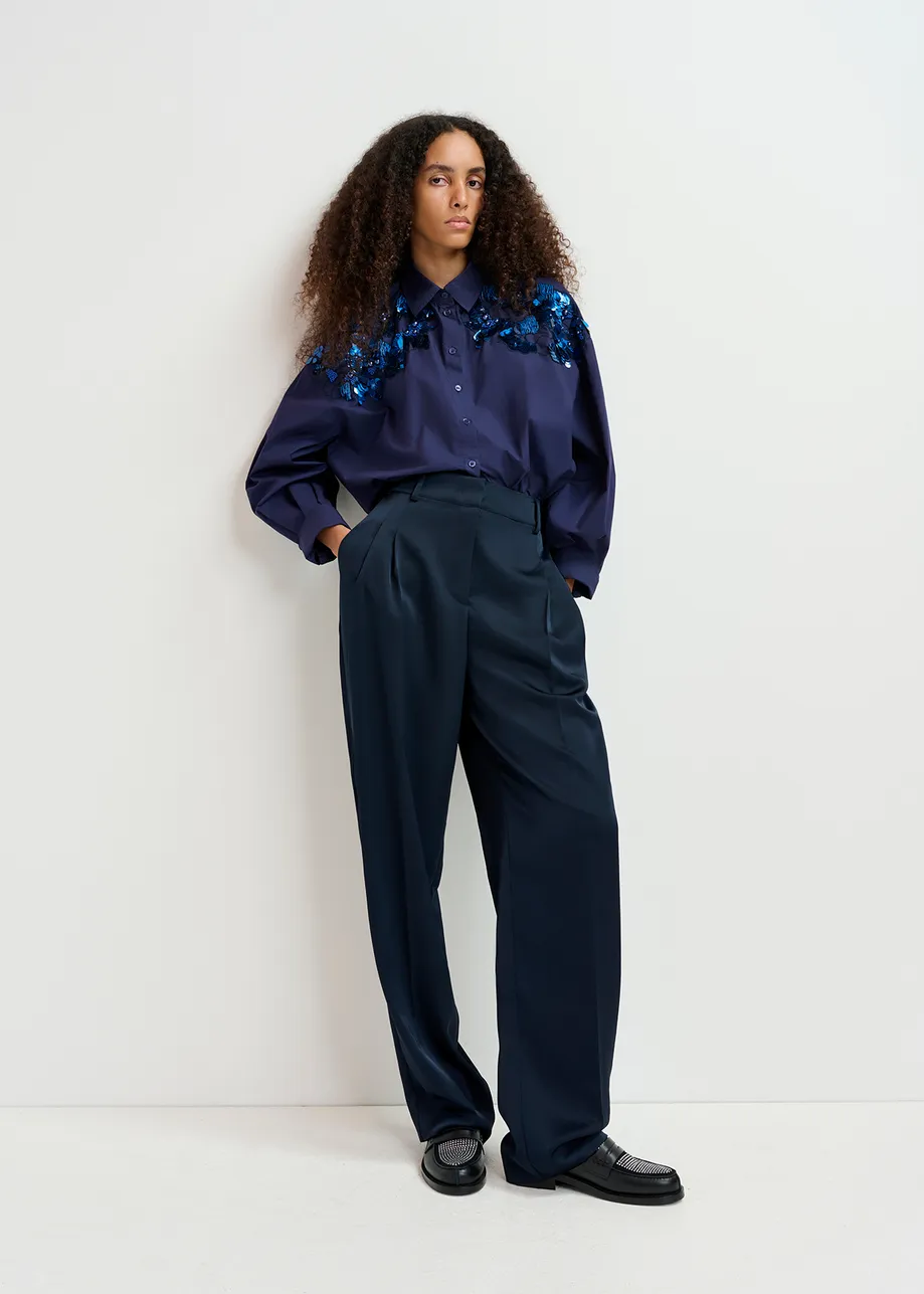 Navy blue tapered-leg satin pants