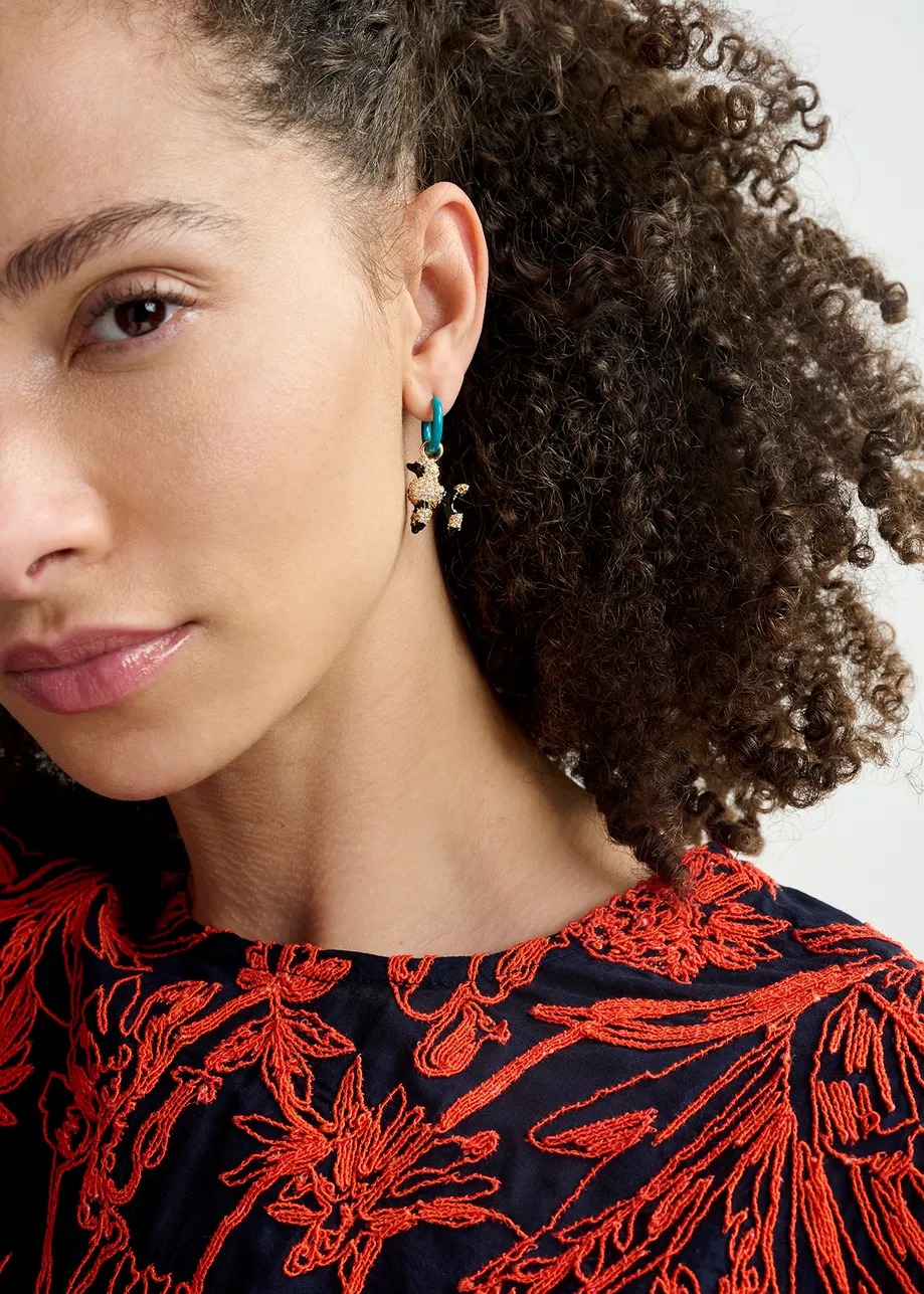 Blue hoop earrings with lipstick and poodle pendants