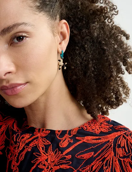 Blue hoop earrings with lipstick and poodle pendants