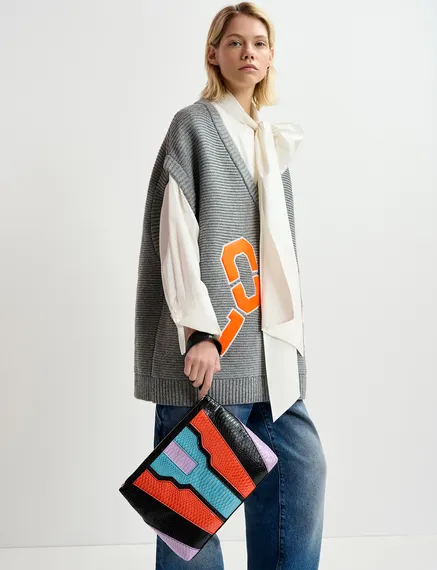 Grey sleeveless knit sweater with "love" appliqué