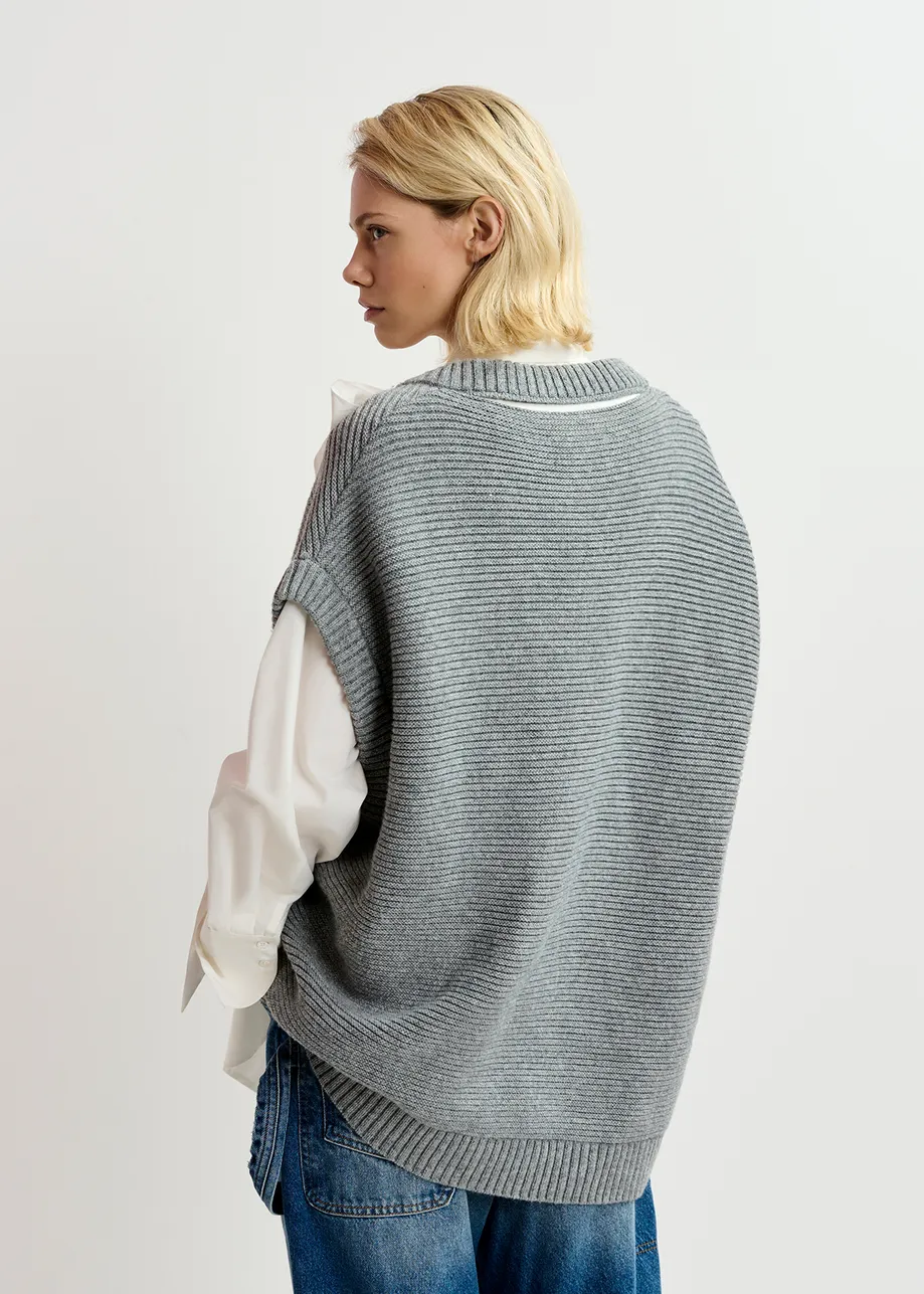 Grey sleeveless knit sweater with "love" appliqué