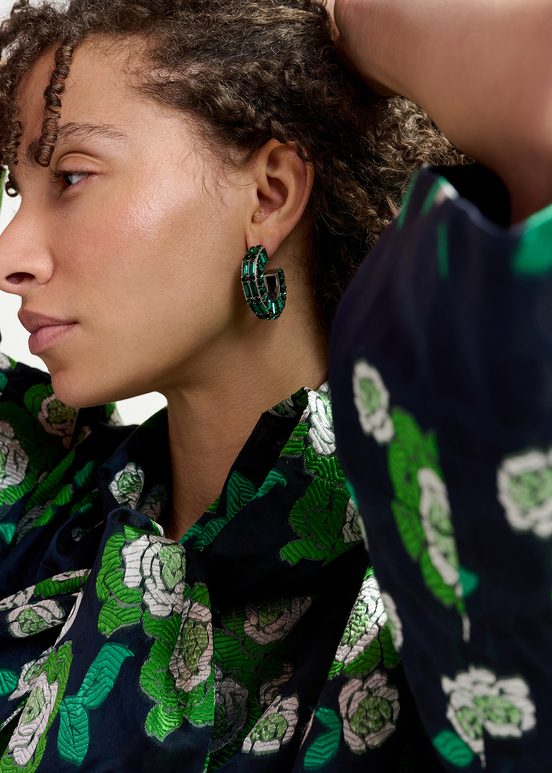 Silver-tone hoop earrings with dark green rhinestones