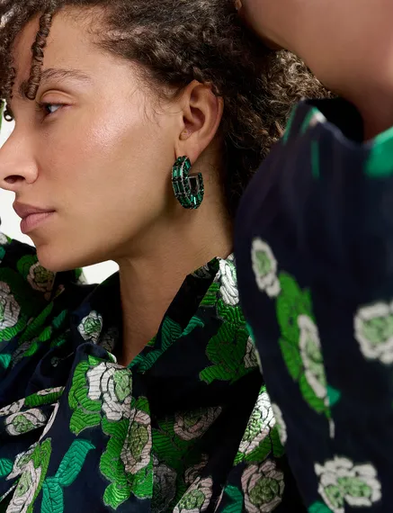 Silver-tone hoop earrings with dark green rhinestones