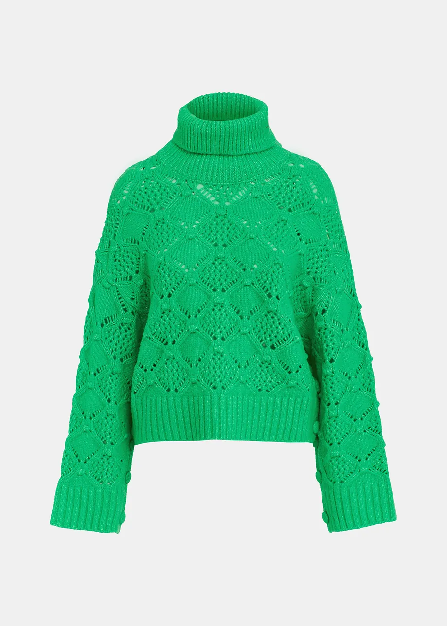 Maglione a collo alto verde lavorato a trecce