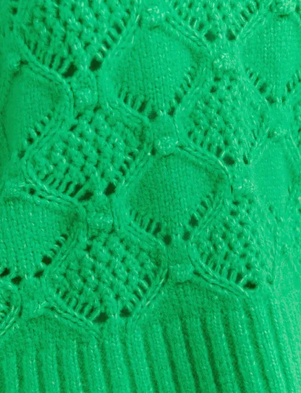 Green cable-knit turtleneck sweater