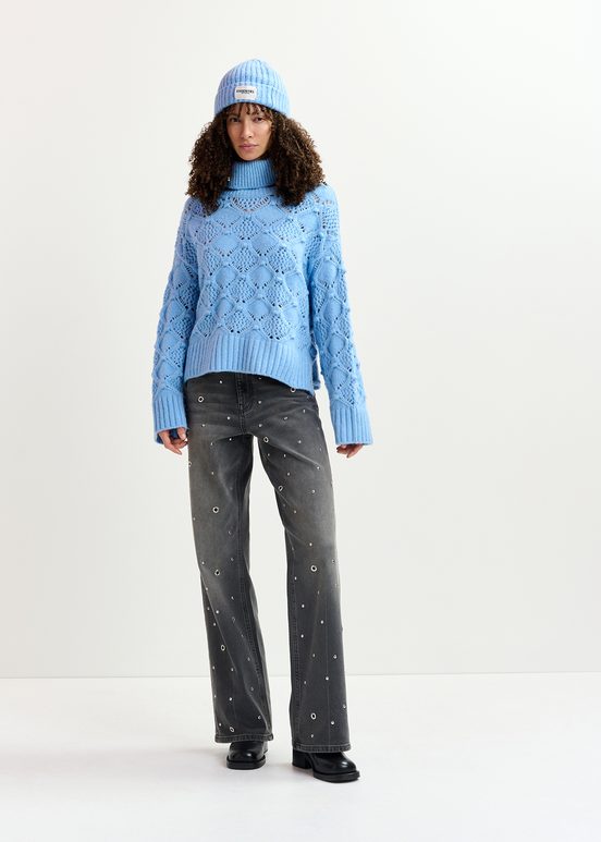 Blue cable-knit turtleneck sweater