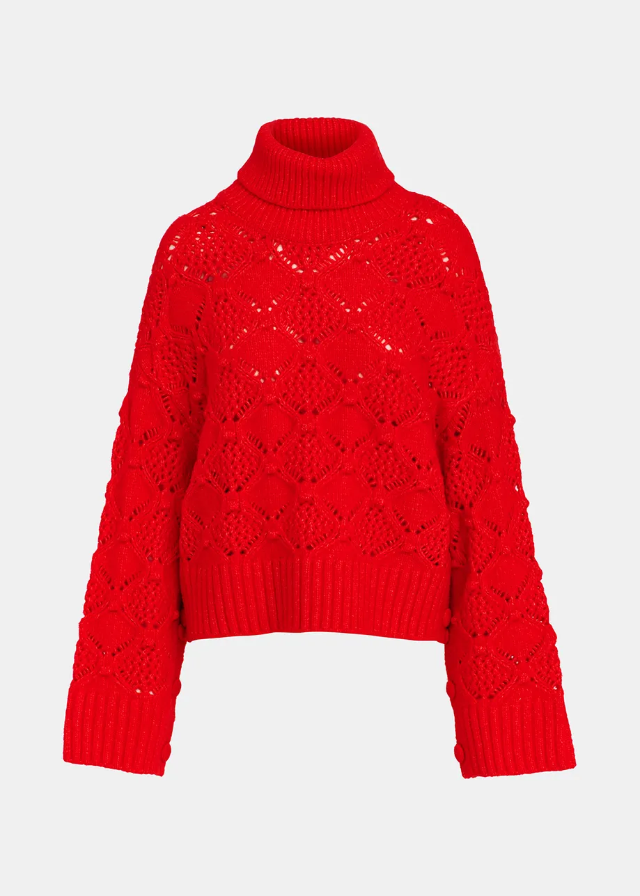 Red cable-knit turtleneck sweater