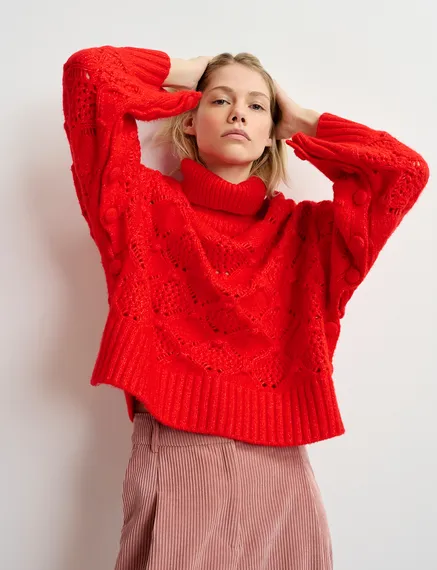 Red cable-knit turtleneck sweater