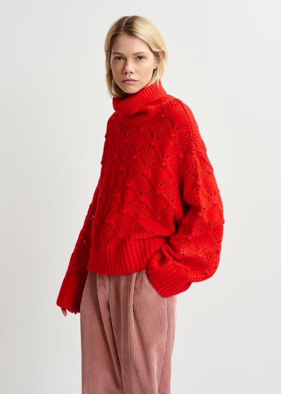 Red cable-knit turtleneck sweater